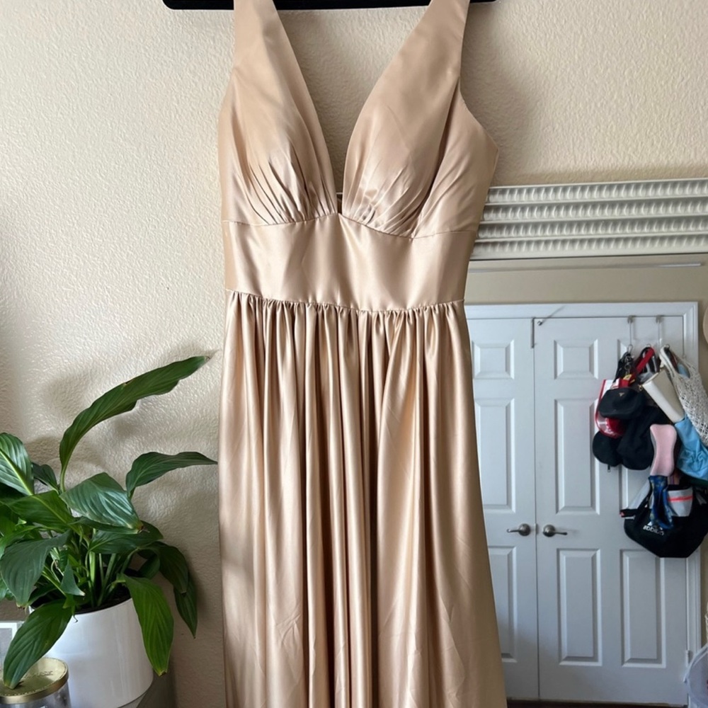 Champagne color bridesmaid dress. Never worn. Reposhing because it didn’t fit me